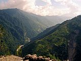 504 Looking Down Modi Khola Valley From Chomrong With New Bridge In Lower Left I left Chomrong (2210m) at 15:05 and continued down the Modi Khola Valley going down, down, down to cross the river. It seems like such a pity that I had to climb up to Chomrong, only to have to descend to the river again. My pack was uneven and I struggled all the way to New Bridge (1340m), arriving at 16:40, and staying at he Hiunchuli Guest House.